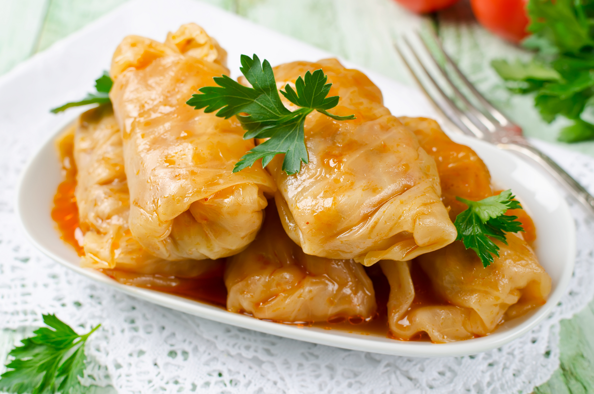 Stuffed cabbage rolls with rice and meat in tomato sauce