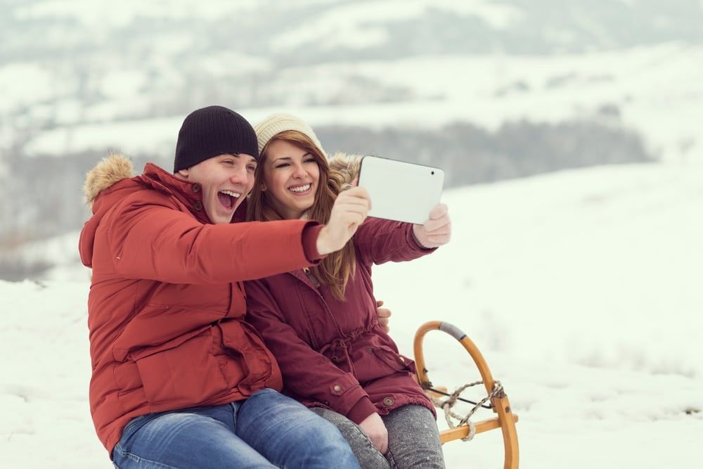 Young-couple-taking-a-selfie-at-one-of-the-top-romantic-places-in-Gatlinburg-during-the-winter